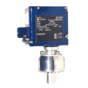 Close-up of a Neo-Dyn differential pressure switch. Blue control box atop a silver pressure sensor. Industrial-grade switch for pressure monitoring.