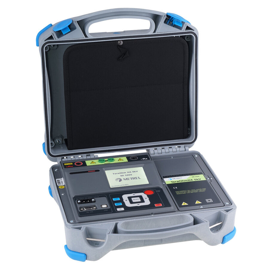 MI 3205 TeraOhm 5kV insulation tester. Portable insulation resistance meter with digital display in an opened gray carrying case.