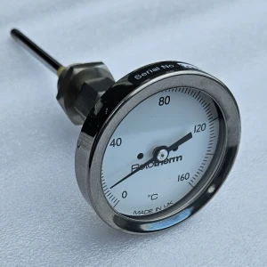 Close-up of a Bi-Metal Temperature Indicator. The Pototherm indicator shows a temperature reading. Made in UK, it's a precise temperature gauge.