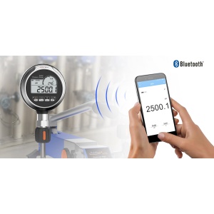 Additel digital pressure gauge with Bluetooth, showing pressure readings on both the gauge and a smartphone app. Wireless pressure measurement.